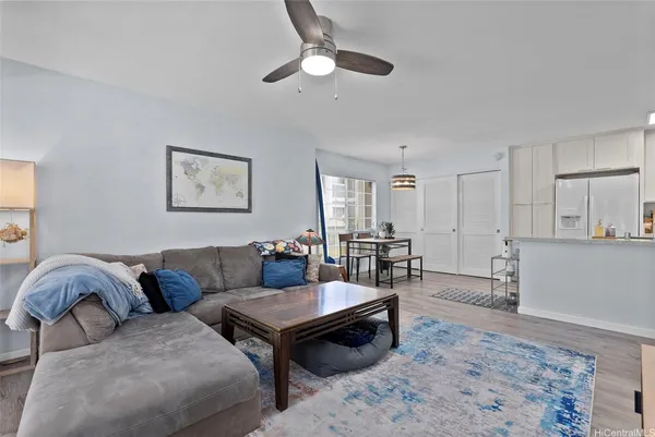 a living room with furniture and a rug