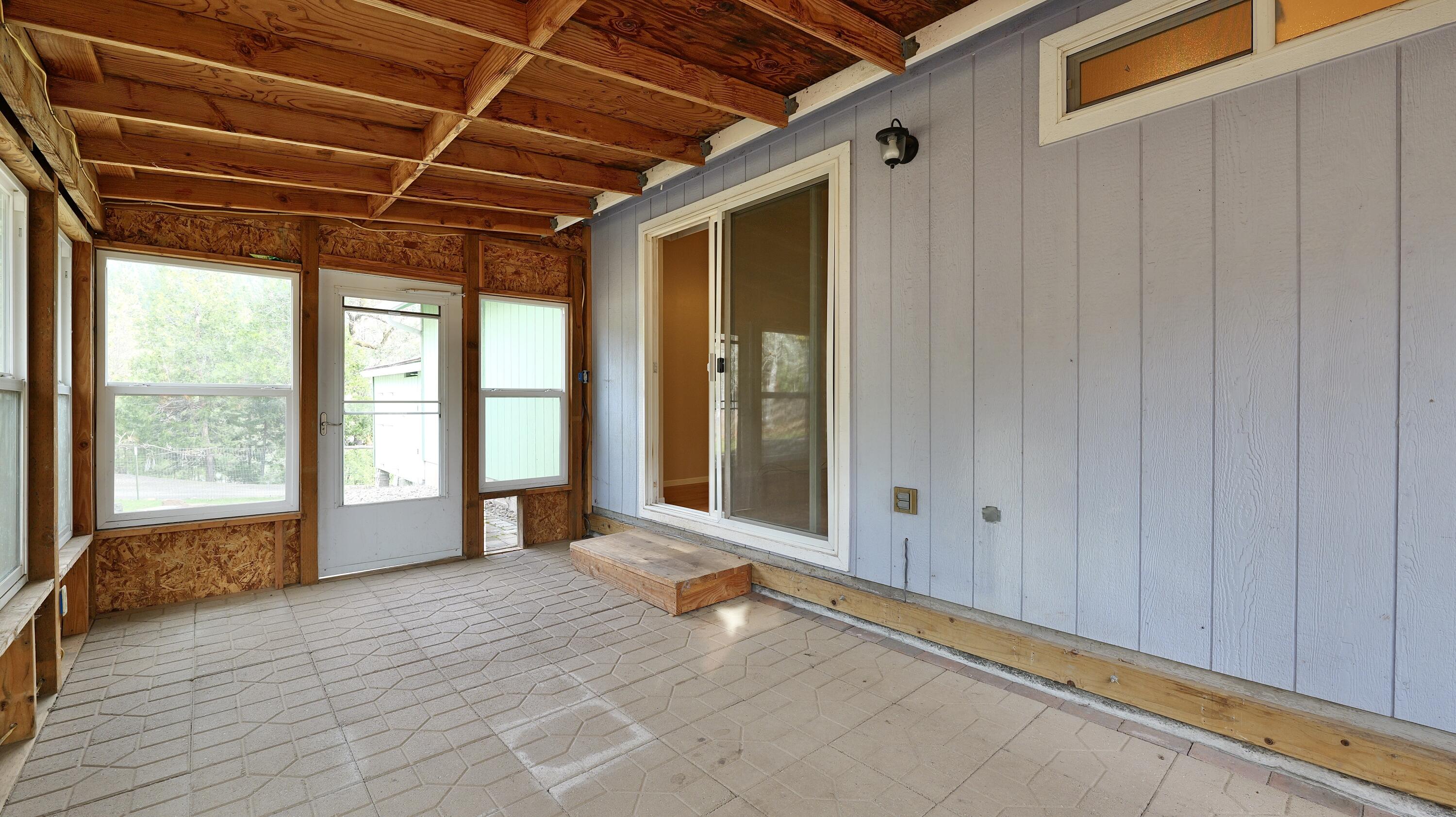 204 Shipley Terrace Prospect, OR 97536 - Photo 19 of 61 a view of a room with wooden floor and windows
