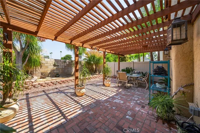 a view of a backyard with sitting area