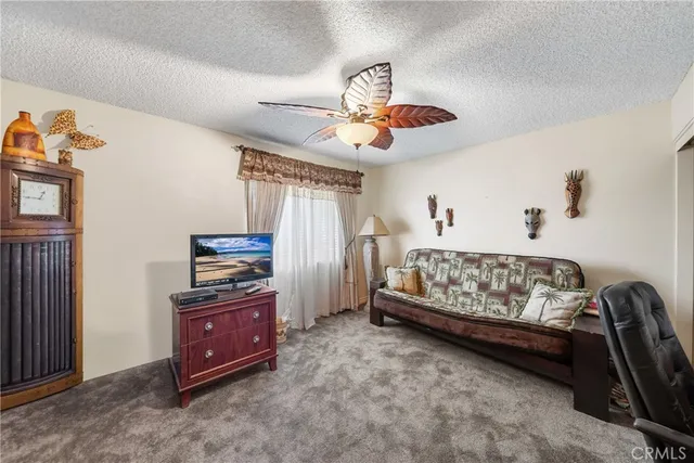 a bedroom with furniture and window