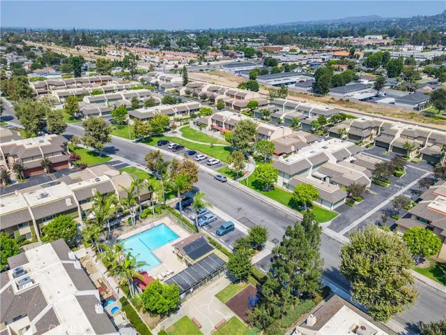 an aerial view of residential house with outdoor space and lake view