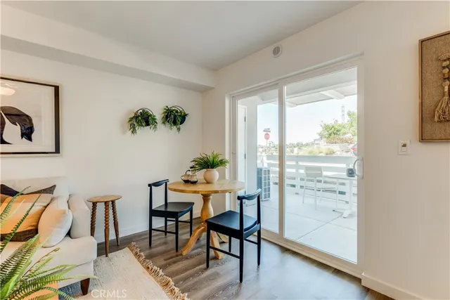 a living room with furniture potted plant and a chandelier