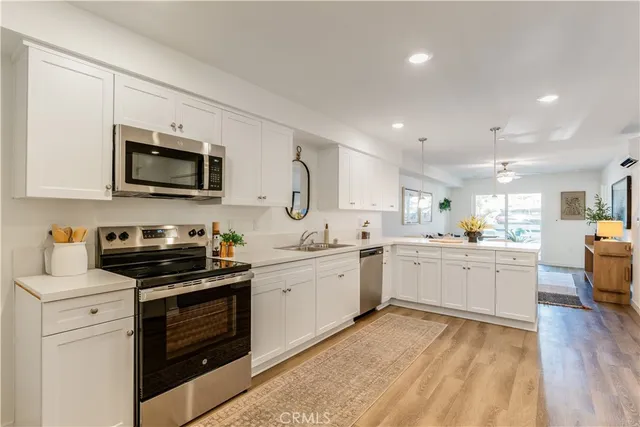 a view of living room with furniture and potted plant