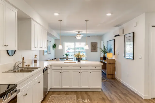 a living room with furniture ceiling fan and a window