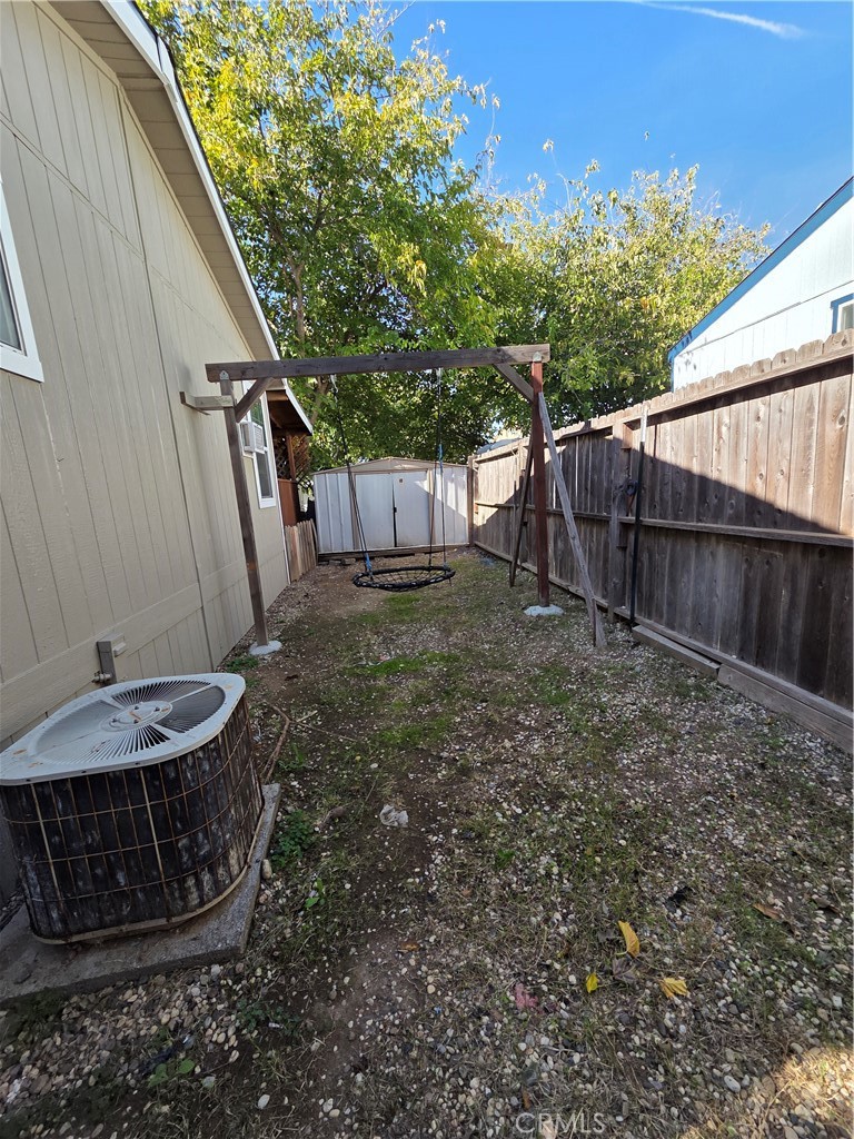 2920 Clark Road, Unit K2 Butte Valley, CA 95965 - Photo 13 of 36 a view of a backyard with a small cabin and wooden fence