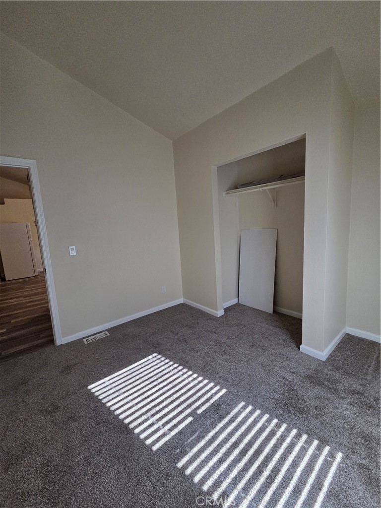 2920 Clark Road, Unit K2 Butte Valley, CA 95965 - Photo 16 of 36 a view of an empty room with wooden floor and a window