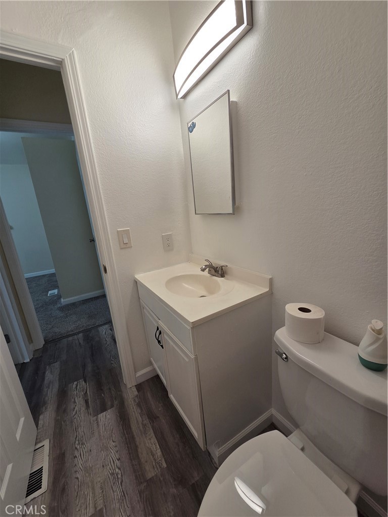 2920 Clark Road, Unit K2 Butte Valley, CA 95965 - Photo 21 of 36 a bathroom with a sink mirror vanity and toilet