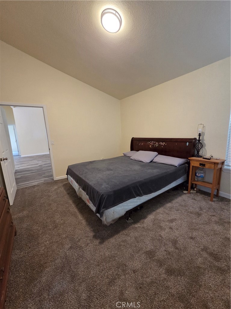 2920 Clark Road, Unit K2 Butte Valley, CA 95965 - Photo 23 of 36 a bedroom with a bed and a lamp on the dresser