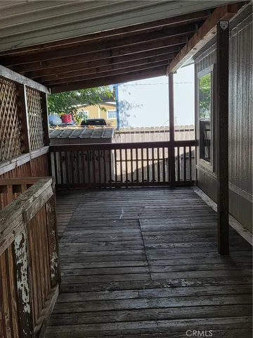 a view of porch with wooden floor