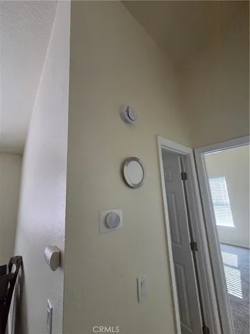 a bathroom with a shower and mirror