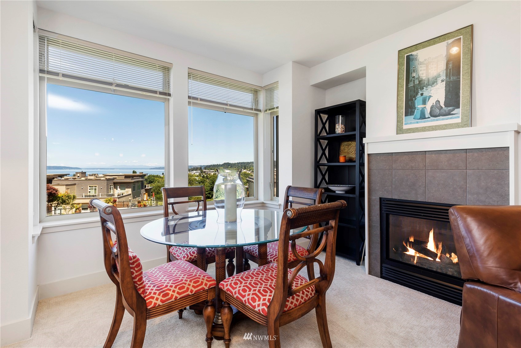 75 Pine Street, Unit 205 Edmonds, WA 98020 - Photo 16 of 33 a dining room with furniture a rug and a fireplace