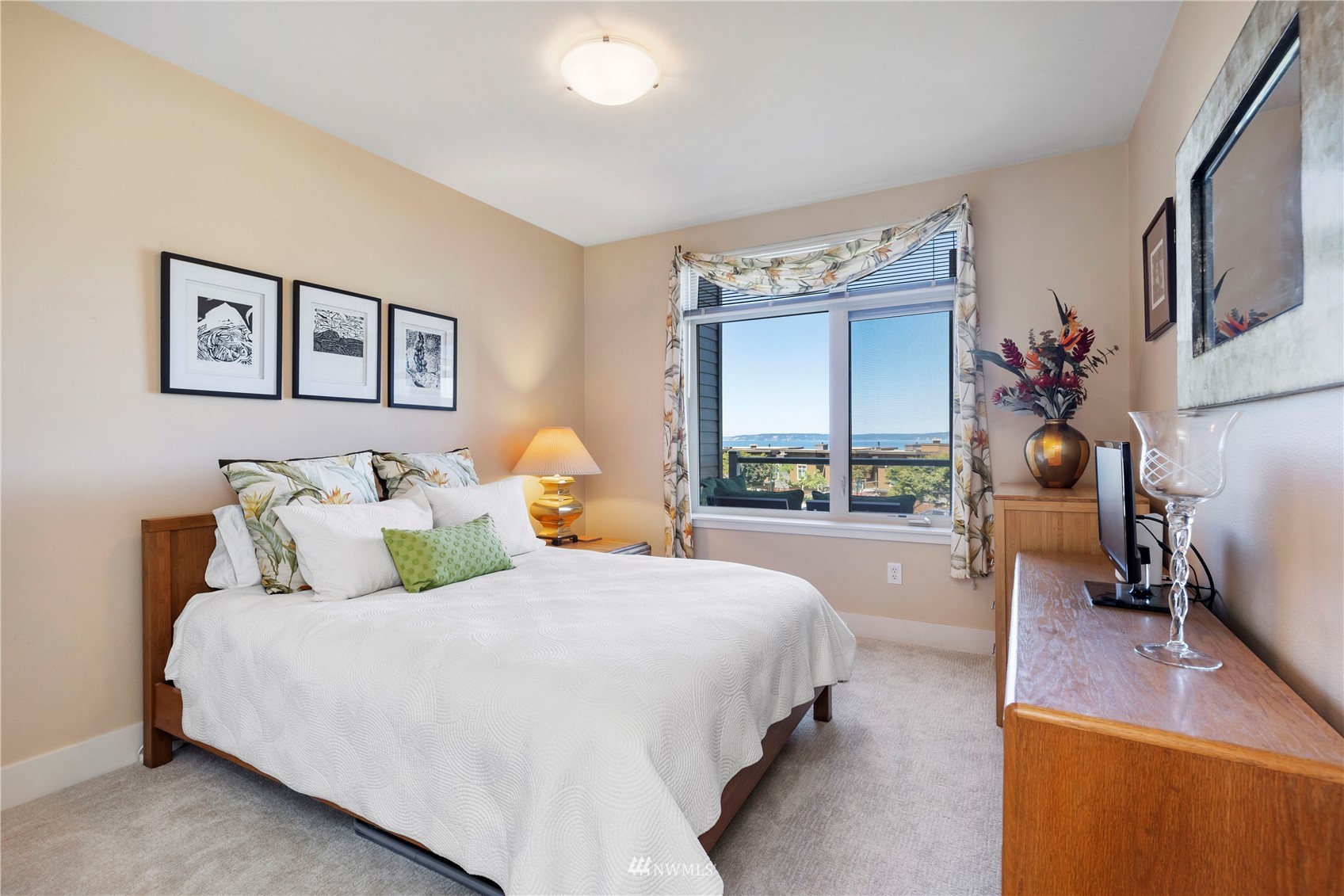 75 Pine Street, Unit 205 Edmonds, WA 98020 - Photo 17 of 33 a bed room with a bed and a large window