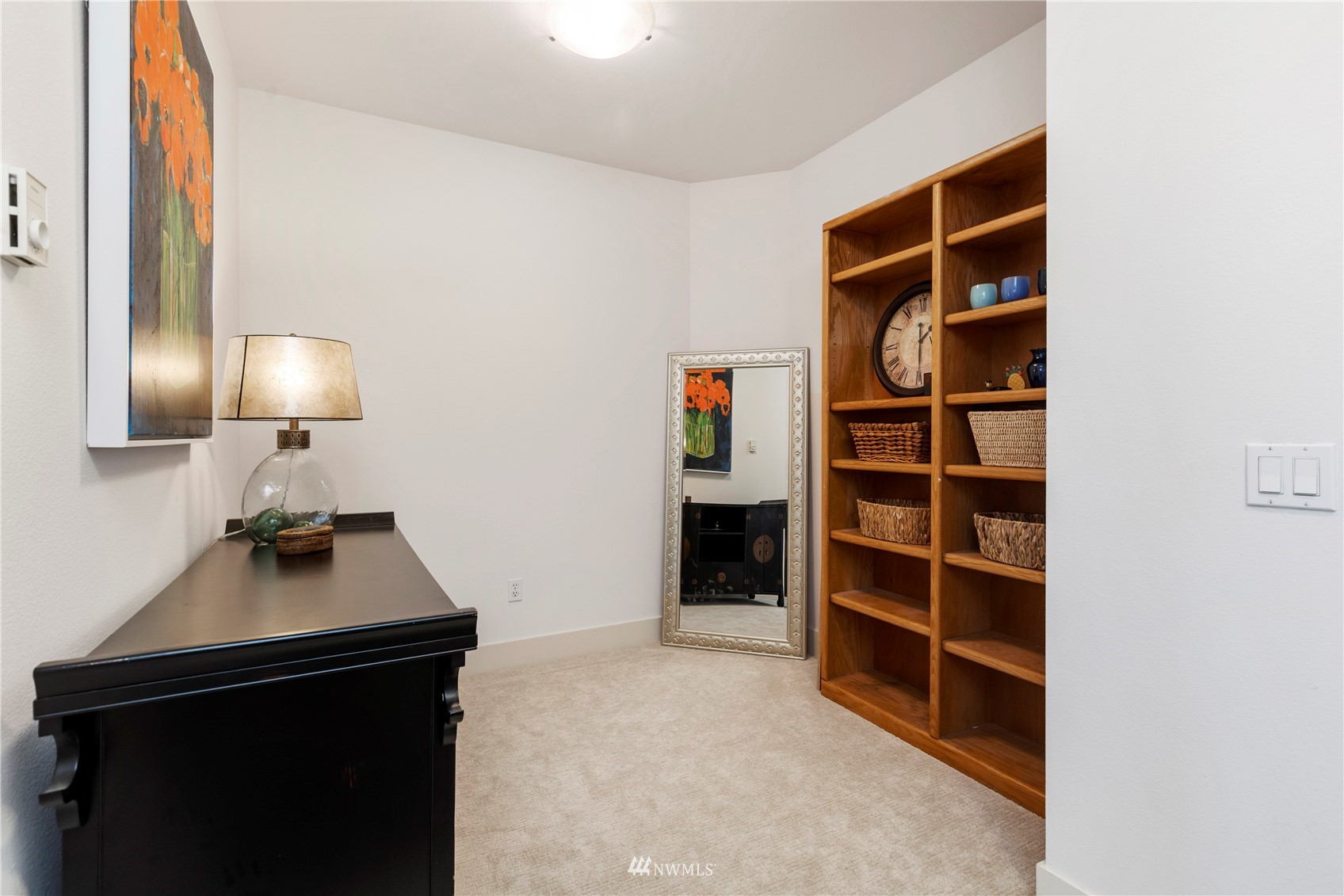 75 Pine Street, Unit 205 Edmonds, WA 98020 - Photo 22 of 33 a room with furniture and a lamp