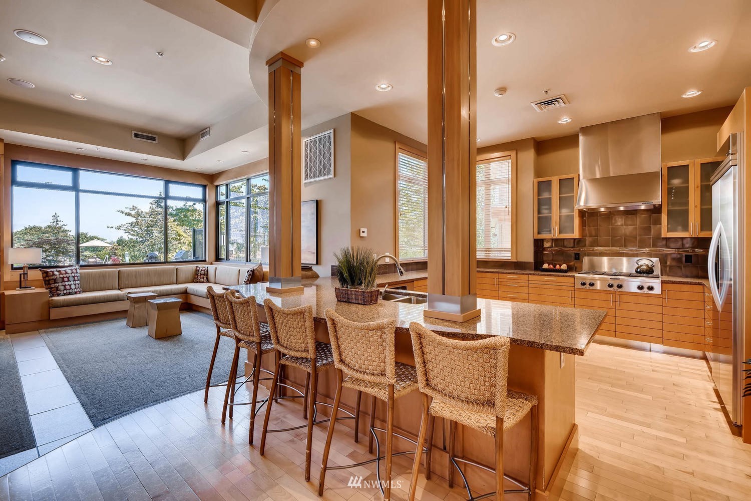 75 Pine Street, Unit 205 Edmonds, WA 98020 - Photo 29 of 33 a room with lots of tables a large window and chairs