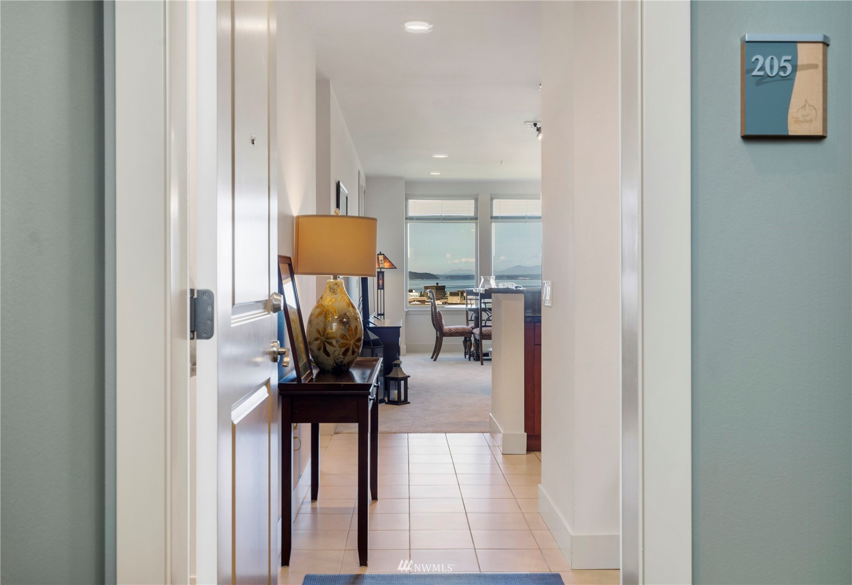 75 Pine Street, Unit 205 Edmonds, WA 98020 - Photo 4 of 33 a view of a hallway with living room and furniture