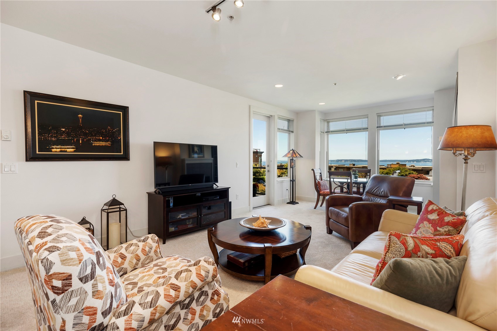 75 Pine Street, Unit 205 Edmonds, WA 98020 - Photo 10 of 33 a living room with furniture a flat screen tv and kitchen view