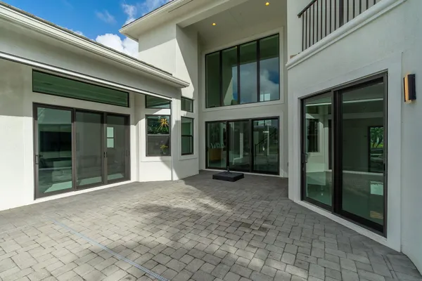 a swimming pool with outdoor seating and yard