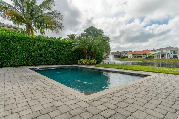 a view of swimming pool with a patio
