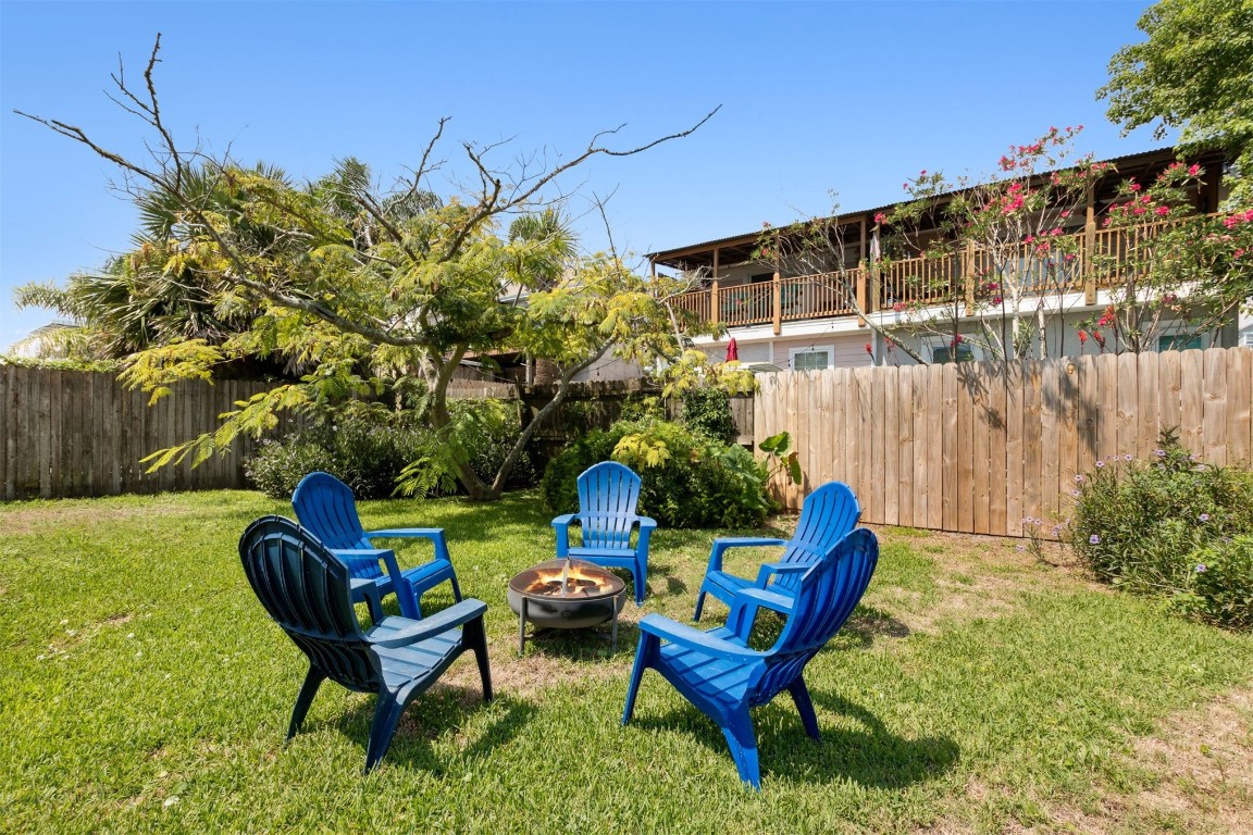 729 North Fletcher Avenue Fernandina Beach, FL 32034 - Photo 18 of 25 a backyard of a house with table and chairs