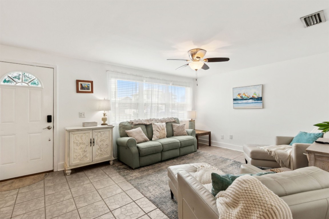 729 North Fletcher Avenue Fernandina Beach, FL 32034 - Photo 5 of 25 a living room with furniture and a chandelier