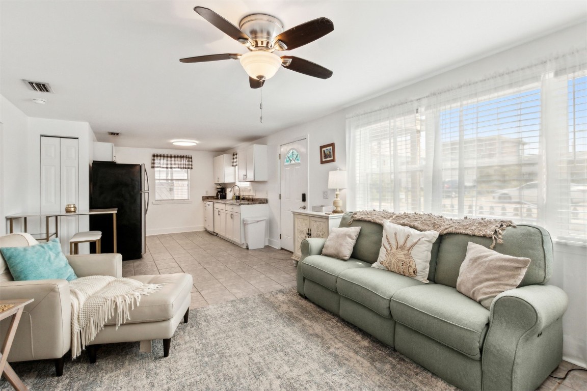 729 North Fletcher Avenue Fernandina Beach, FL 32034 - Photo 6 of 25 a living room with furniture and a large window with kitchen view