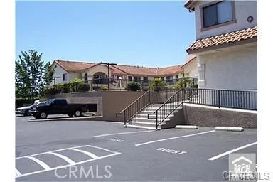 a view of a car park in front of a building