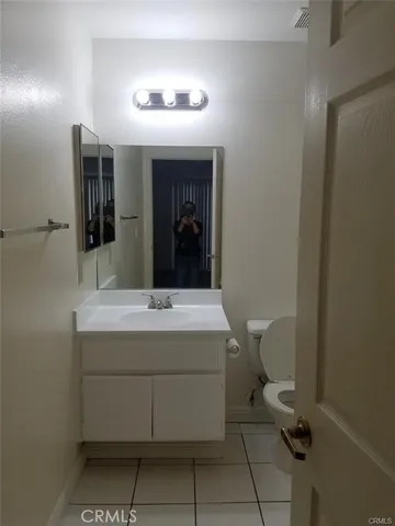 a kitchen with stainless steel appliances a sink dishwasher stove top oven and cabinets