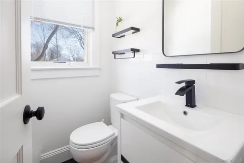a bathroom with a toilet and a sink
