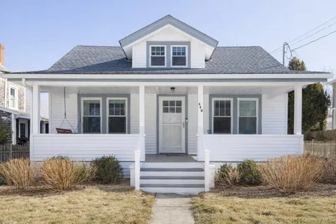 a front view of a house with a rug