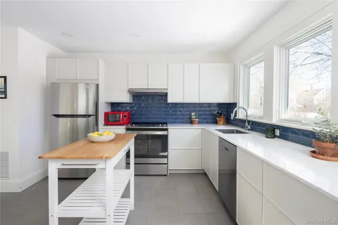 a kitchen with a sink stove and refrigerator