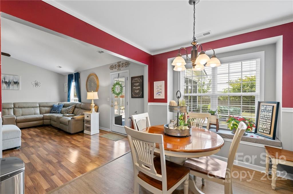 201 Pamlico Road Fletcher, NC 28732 - Photo 7 of 28 a view of a dining room with furniture large windows and wooden floor