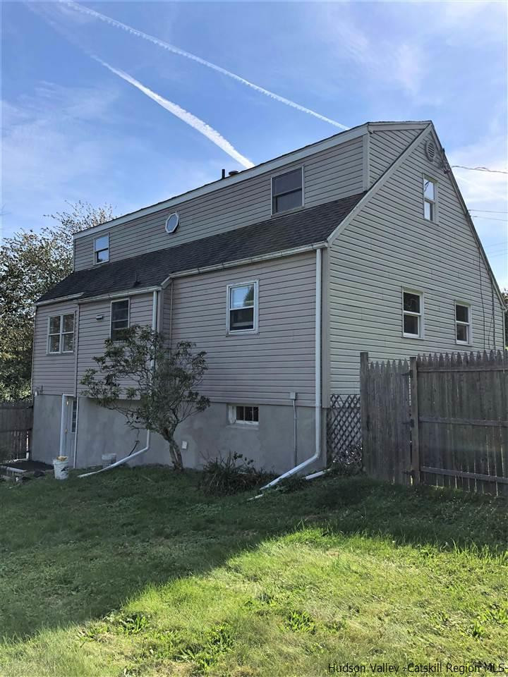 4 Gate Road Highland, NY 12528 - Photo 25 of 28 a backyard of a house with plants and a garden