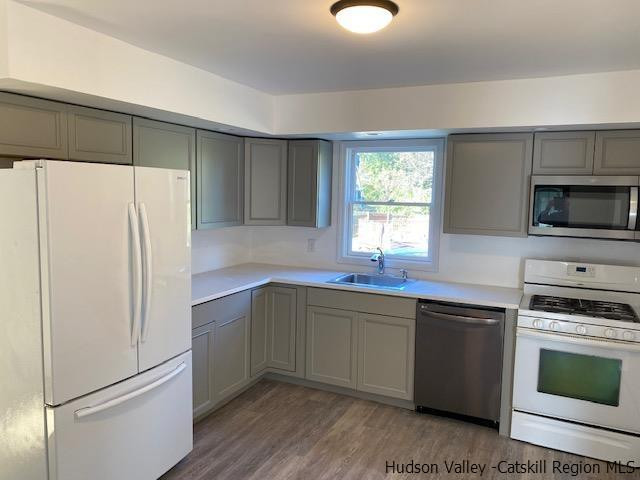 4 Gate Road Highland, NY 12528 - Photo 3 of 28 a kitchen with a refrigerator sink and stove top oven