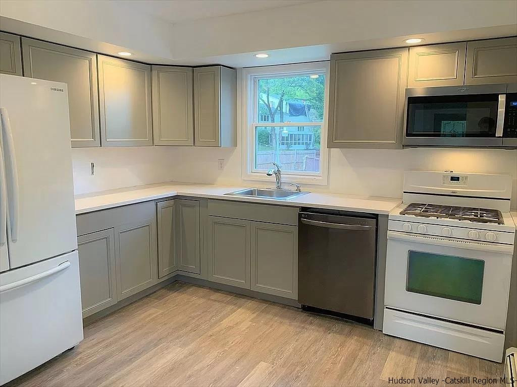 4 Gate Road Highland, NY 12528 - Photo 4 of 28 a kitchen with a sink stove and microwave