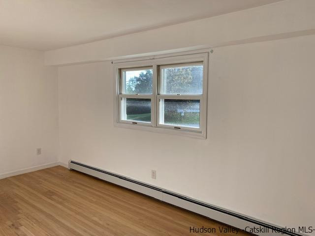4 Gate Road Highland, NY 12528 - Photo 8 of 28 a view of an empty room with wooden floor and a window