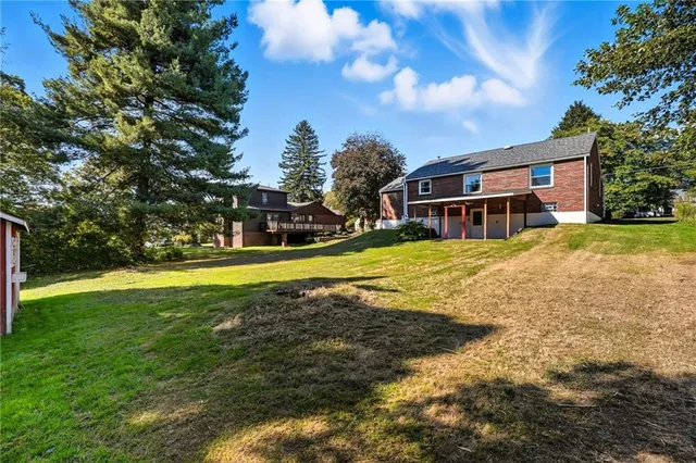 a view of a house with a big yard