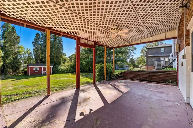 a view of a house with a yard and garage