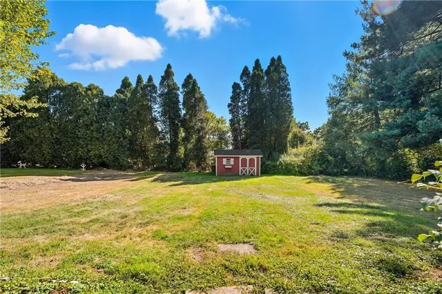 a bathroom with a toilet sink and shower