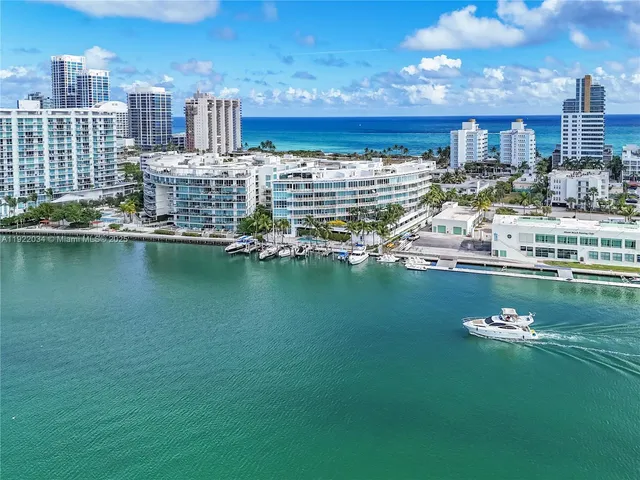 an aerial view of a house with a lake view