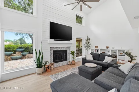 a kitchen with stainless steel appliances a refrigerator a stove and white cabinets