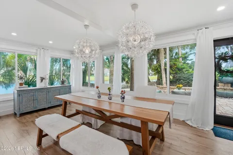 a living room with furniture a wooden floor and a window
