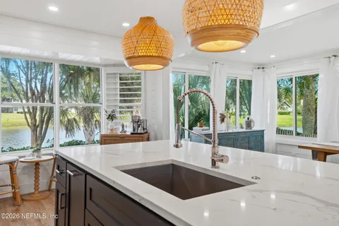 a view of a living room with furniture and a window