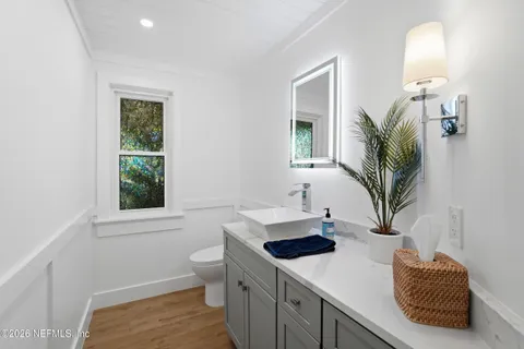 a outdoor dining space with a table and chairs