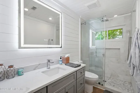 a dining room with furniture a chandelier and a rug