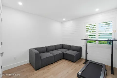 a view of a backyard with sitting area