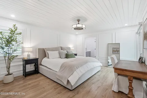 a view of a patio with couple of chairs and a fire pit