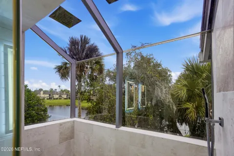 a view of a lake with houses in the back