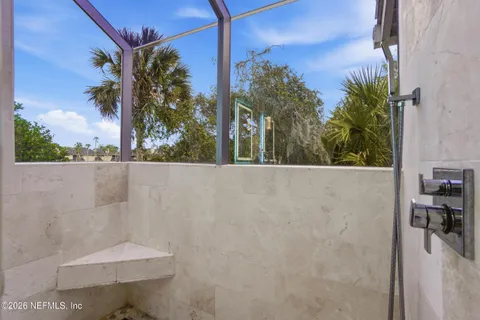 a view of a lake with houses in the back