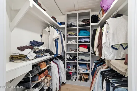 an aerial view of lake and residential houses with outdoor space