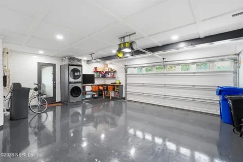 an aerial view of a house with a lake view